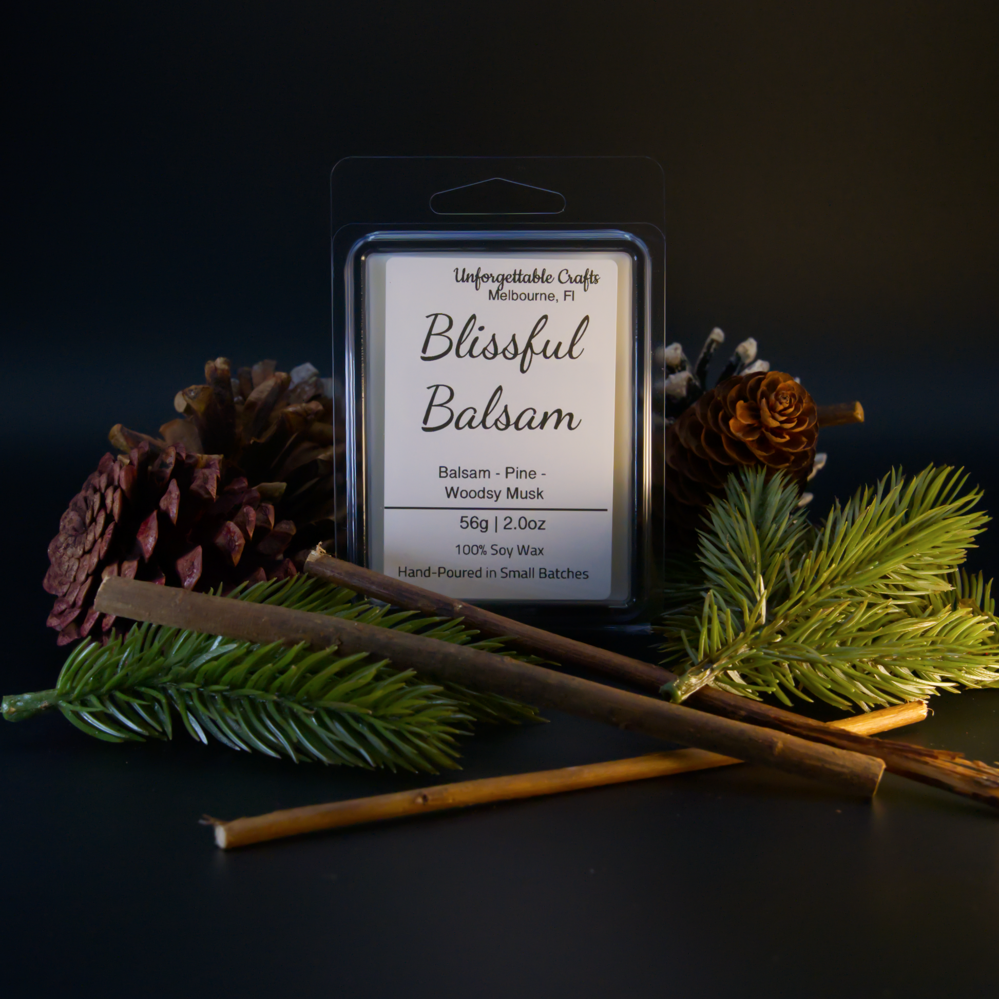 Wax melt packaging labeled 'Blissful Balsam' with decorative elements on a dark background