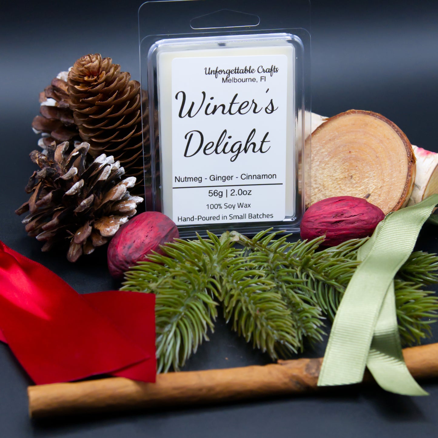 Wax melt package labeled 'Winter's Delight' with decorative elements on a dark background