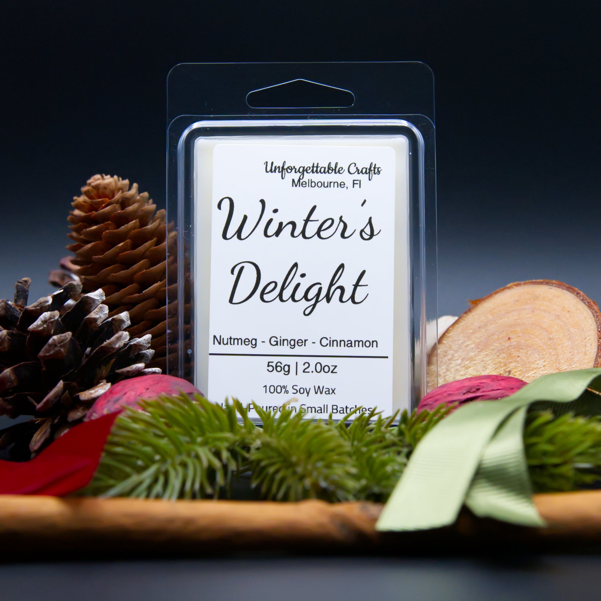 Wax melt package labeled 'Winter's Delight' with decorative elements on a dark background